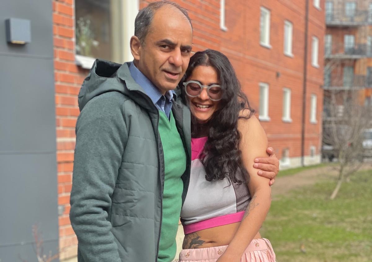 My dad and me, hugging, smiling, on a quiet street